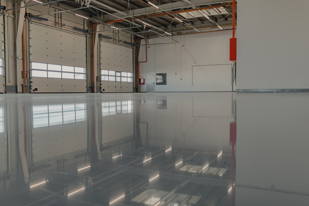 Epoxy and waxed flooring with colorful signage in car service